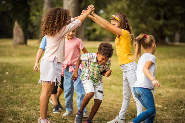 Large group of school kids having fun in nature.